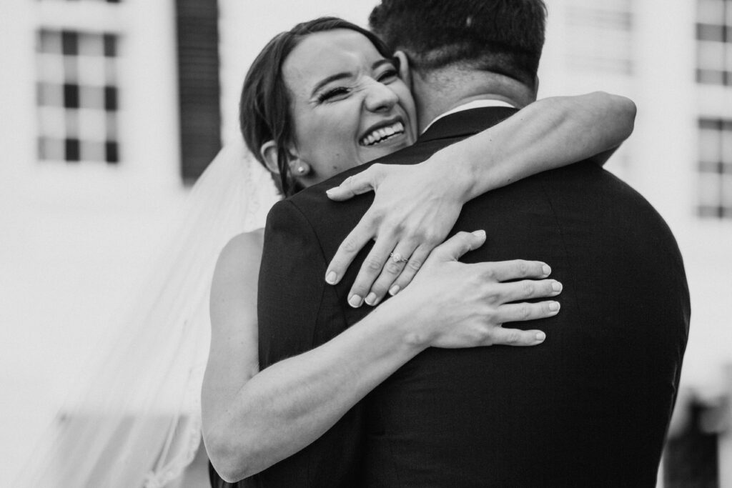 Joyful bride during a first look with her groom