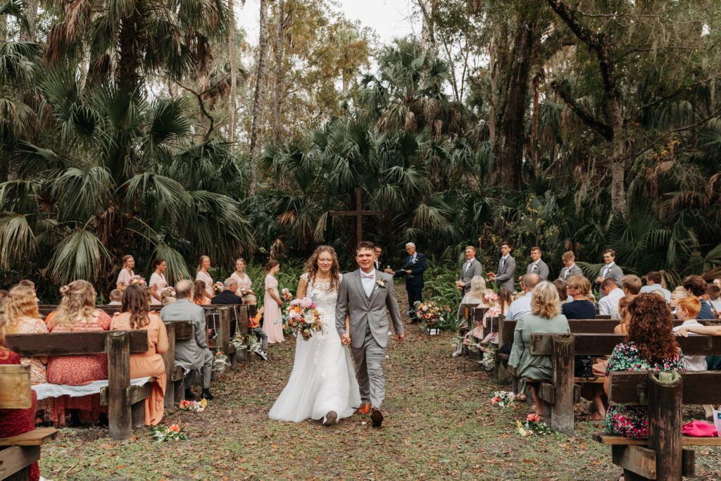 Bride and groom exiting their wedding ceremony at Highlands Hammock State Park.