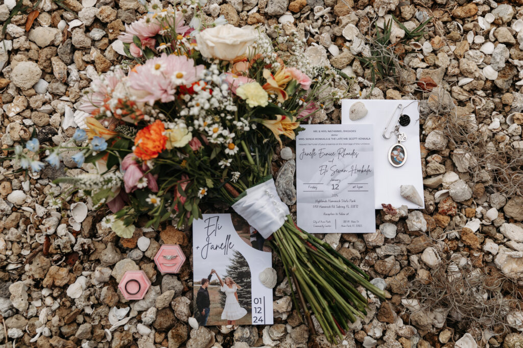 wedding flat lay on a bed of seashells