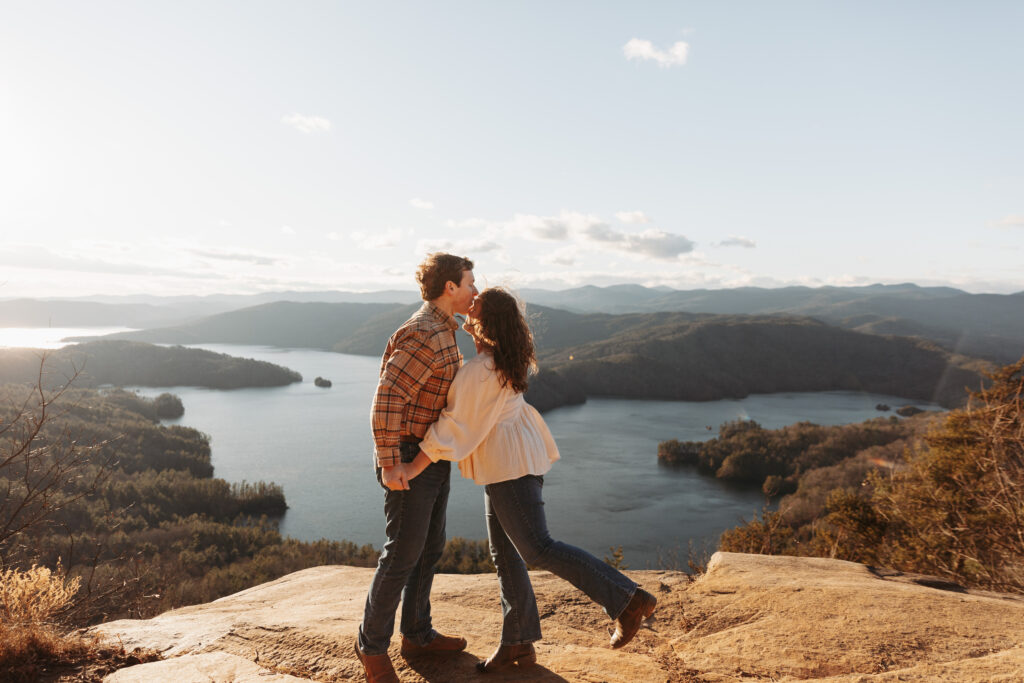 Engaged couple at Lake Jocassee Overlook at sunset