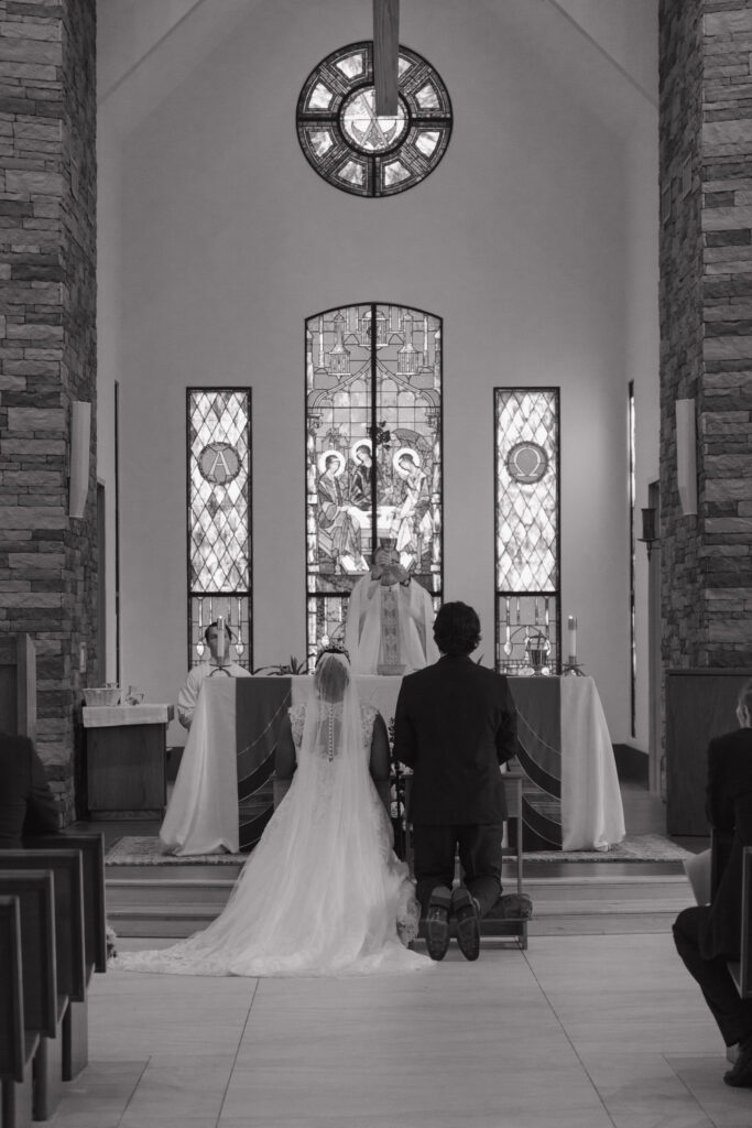 bride and groom during a Catholic wedding ceremony