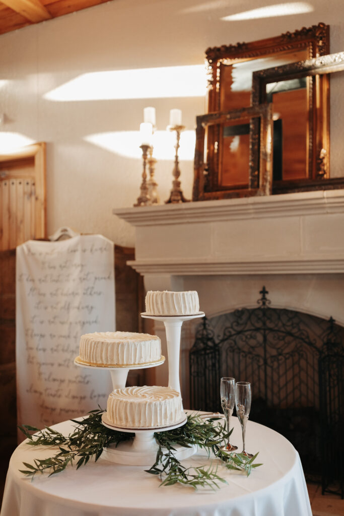 three wedding cakes at varying heights 