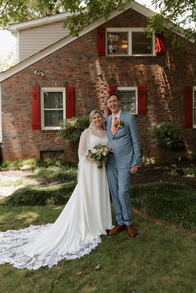 Joyful bride and groom on their summer wedding day in downtown Greenville.