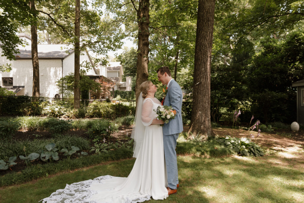 Joyful bride and groom on their summer wedding day in downtown Greenville.