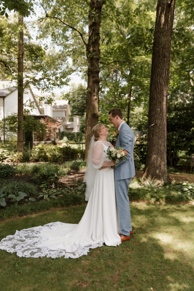 Bride and groom in a downtown Greenville backyard on their summer wedding day.