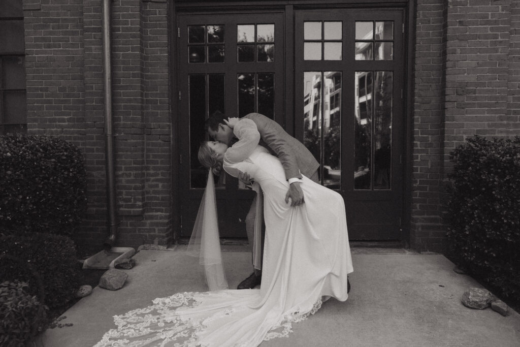 Bride and groom during cocktail hour at their wedding reception at The L in downtown Greenville, SC.