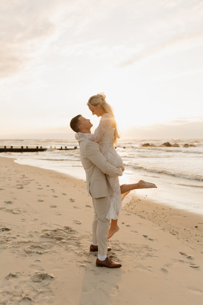 Bride and groom portrait during a sunrise elopement on Folly Beach in South Carolina.