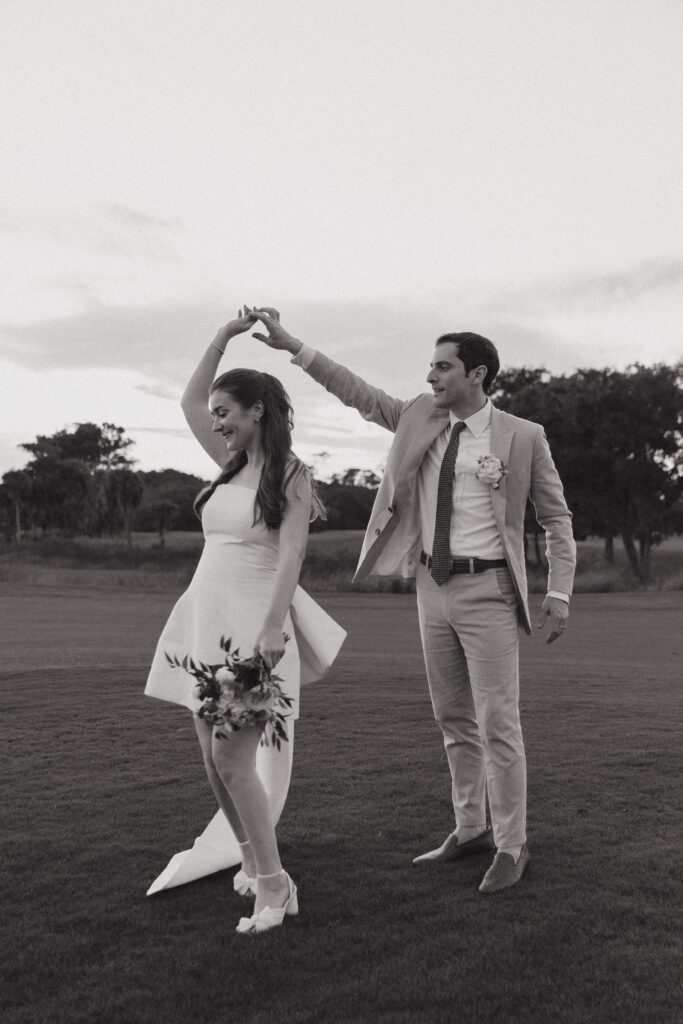 Bride and groom dancing on the golf course at The Golf Club at Briar's Creek on Johns Island, SC.
